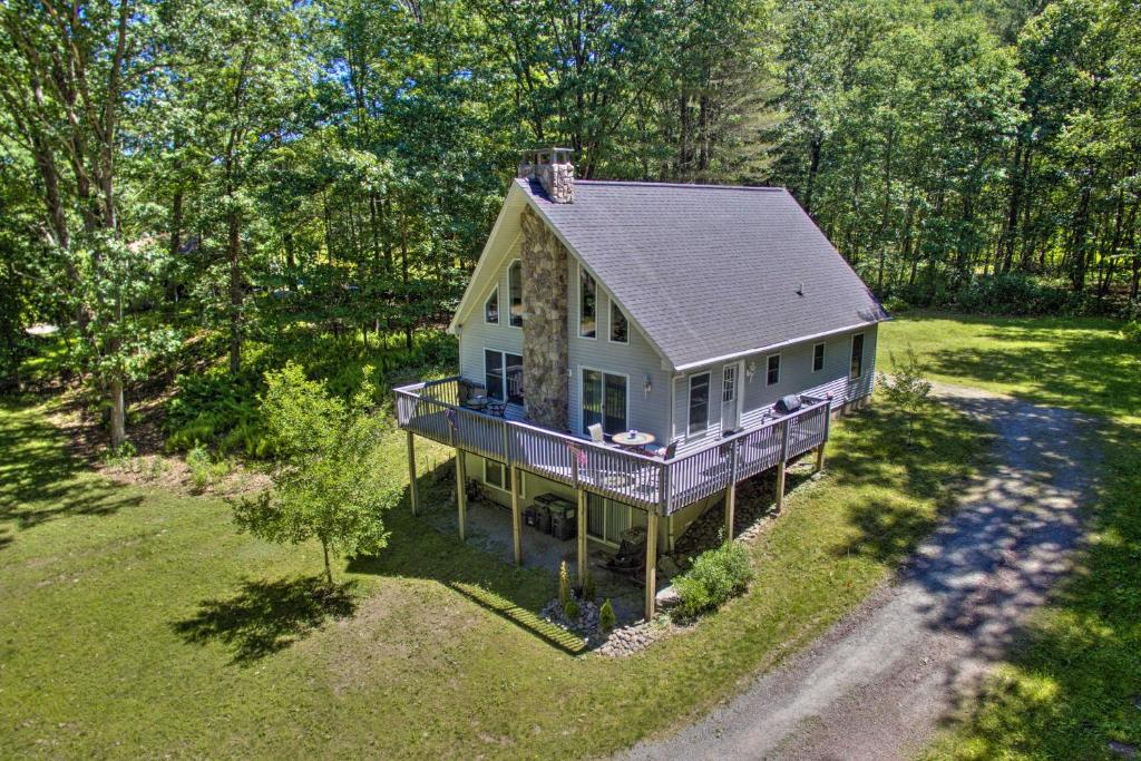 an overhead view of a house in the woods at Spacious Home with Deck, Grill and Delaware River View in Callicoon