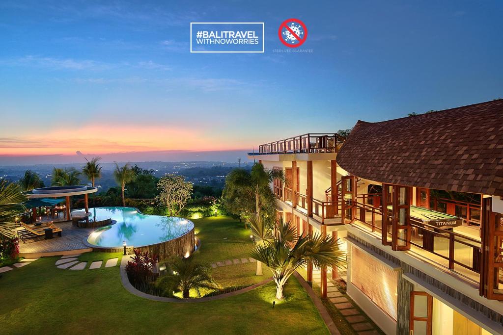 an aerial view of a house with a swimming pool at Casa Bonita Villa Bali in Jimbaran