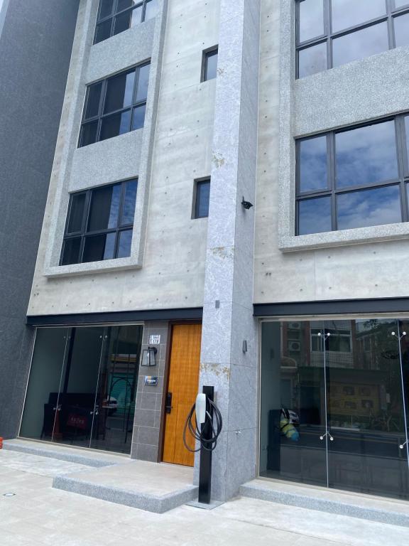 a building with a parking meter in front of it at Golden homestay in Taitung City