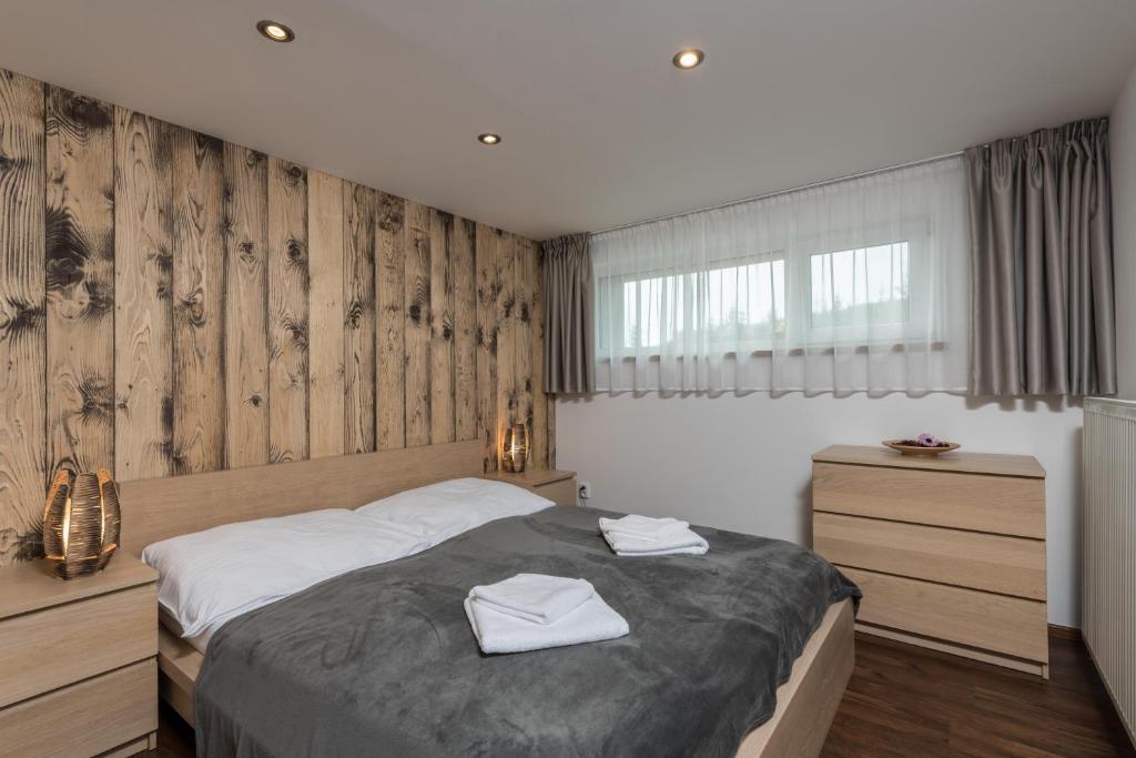 Postel nebo postele na pokoji v ubytování Apartmány 294