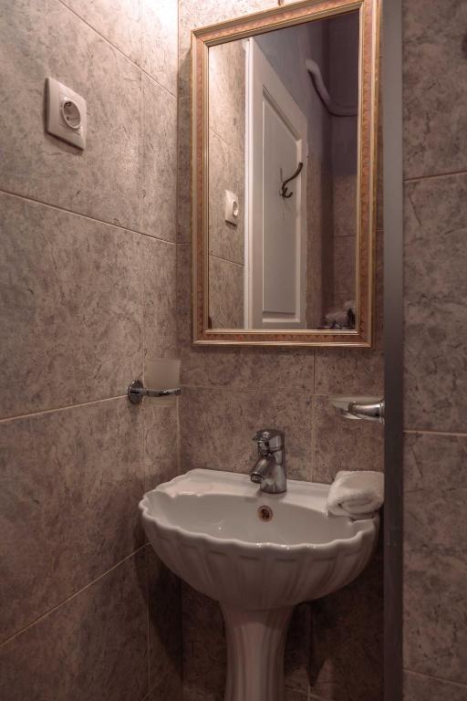 Ванная комната в Ilion Hotel