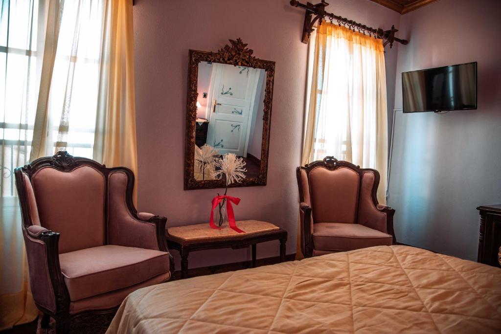 Кровать или кровати в номере Ilion Hotel