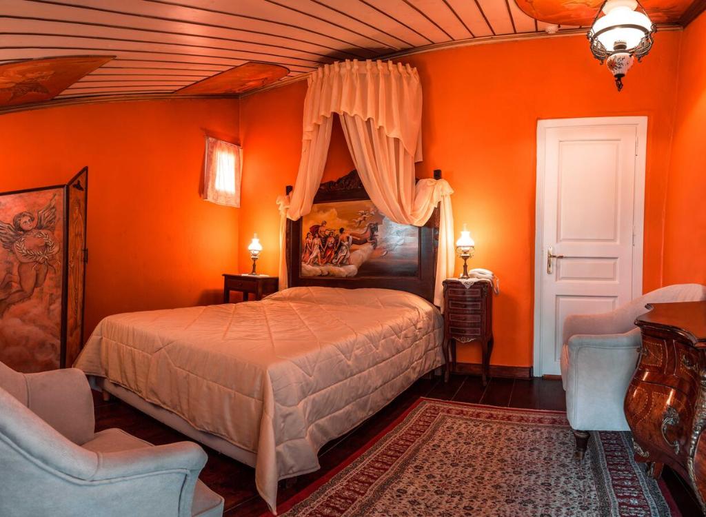 Кровать или кровати в номере Ilion Hotel