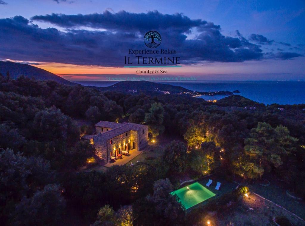an aerial view of a house in the woods at night at Experience Relais " Il Termine Elba " in Rio Marina