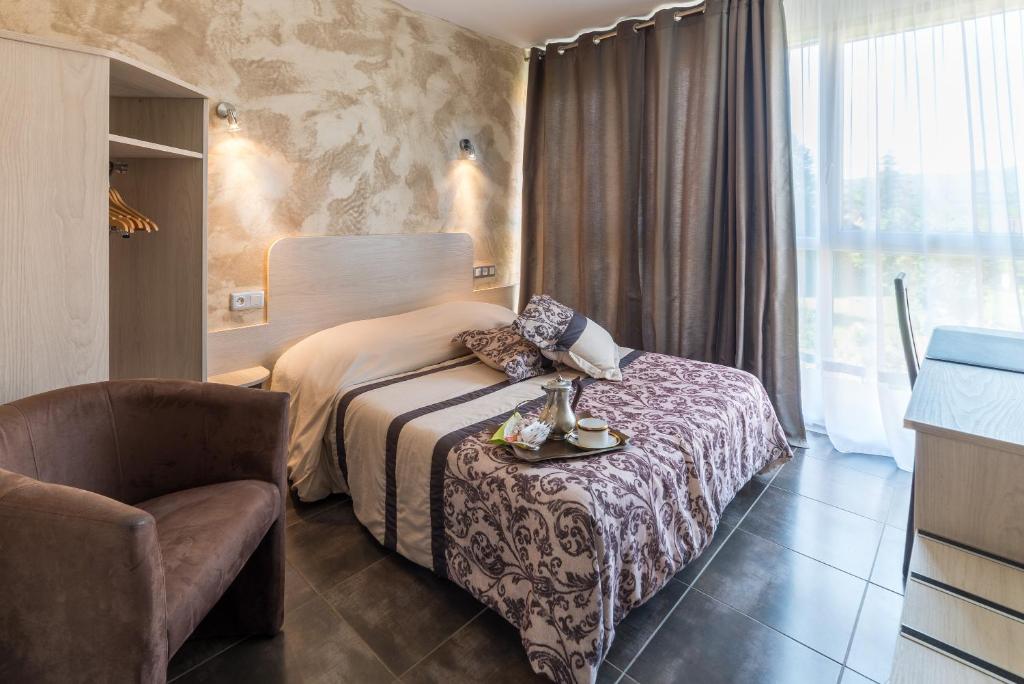Postel nebo postele na pokoji v ubytování Hôtel Morris
