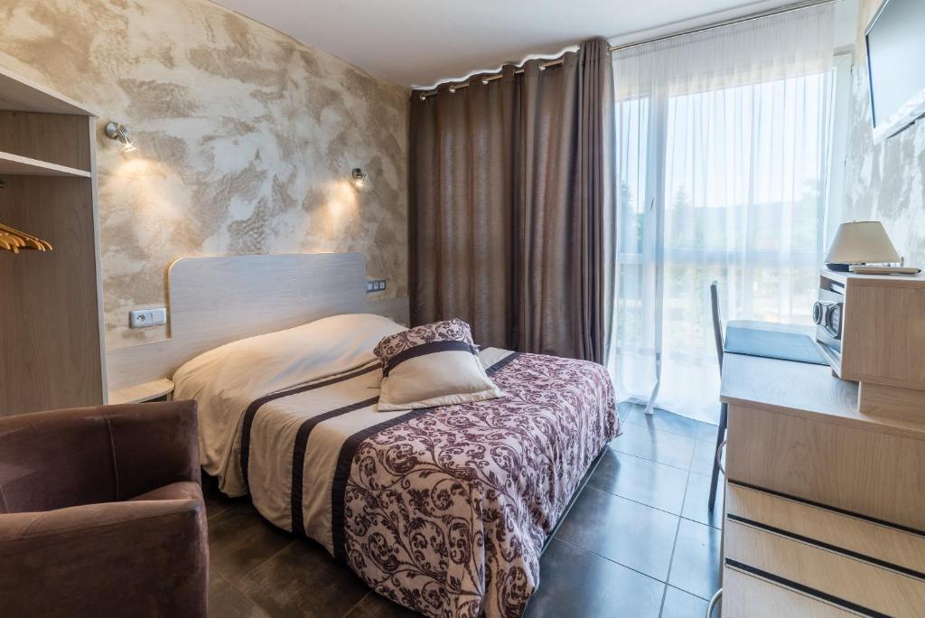 Postel nebo postele na pokoji v ubytování Hôtel Morris