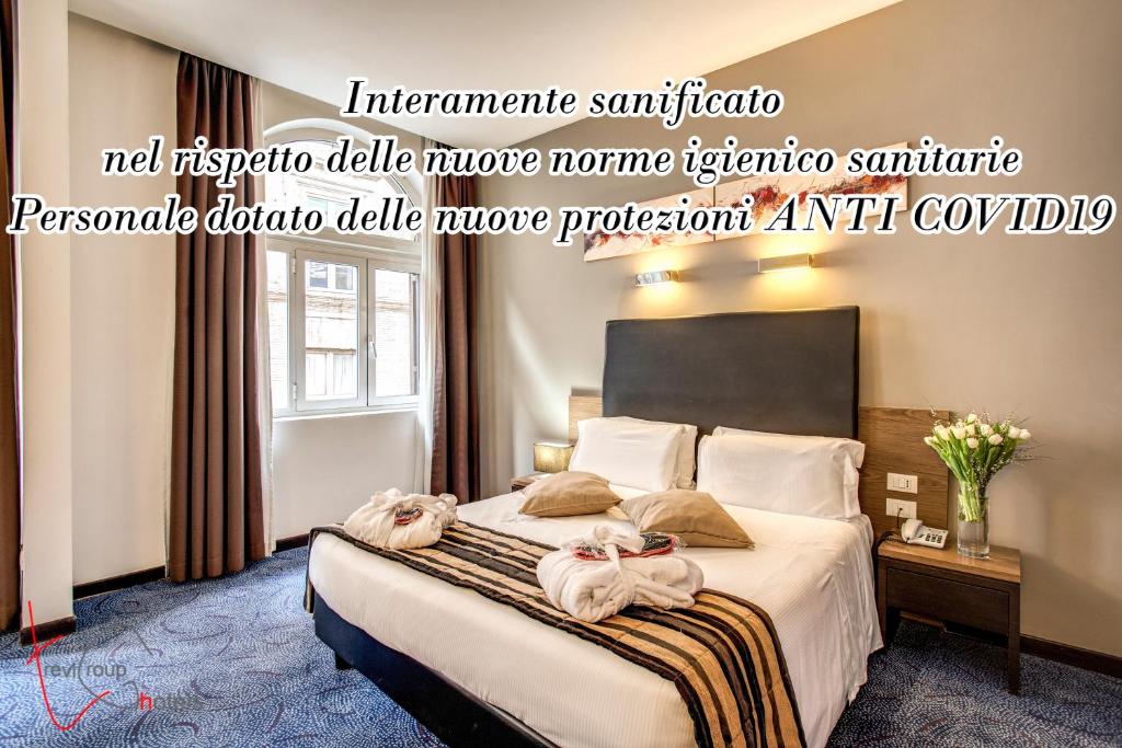 Postel nebo postele na pokoji v ubytování Hotel Rinascimento - Gruppo Trevi Hotels