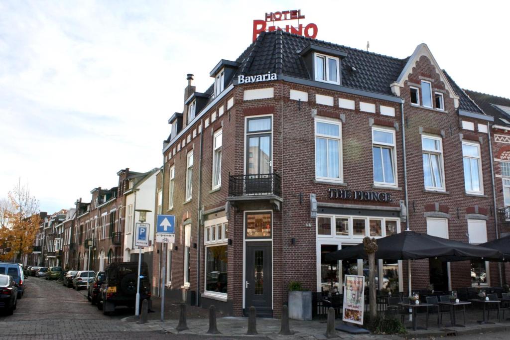 a brick building on a street in a city at Hotel Benno in Eindhoven