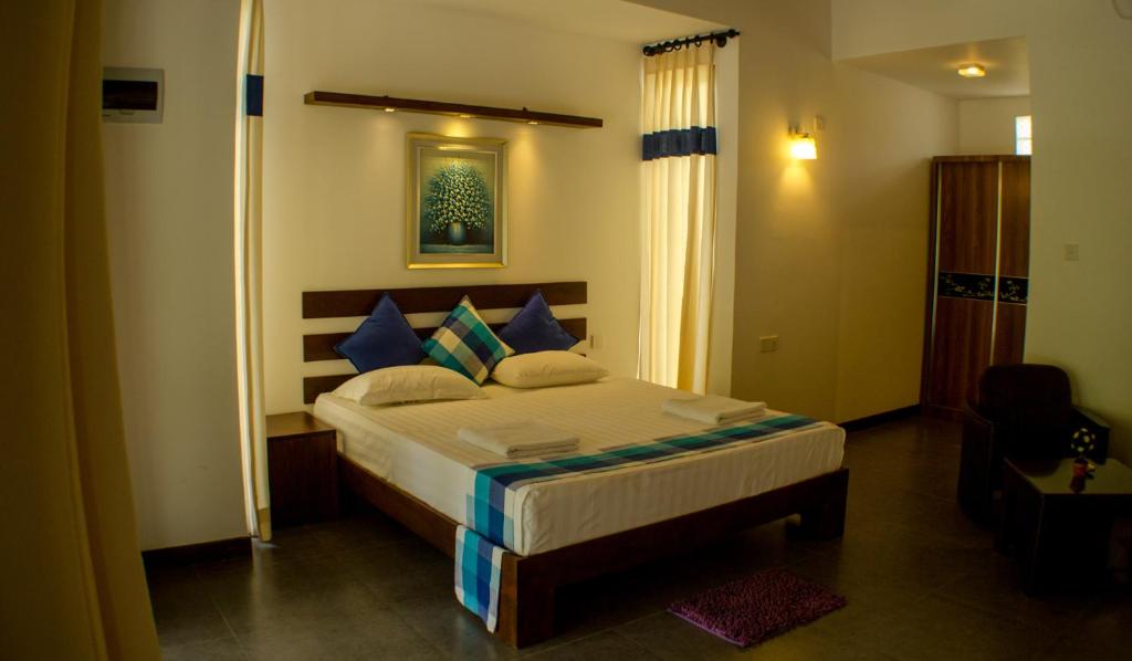 Postel nebo postele na pokoji v ubytování Hotel Alakamanda