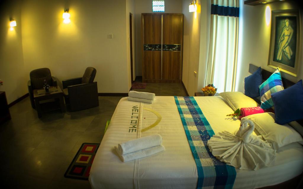Postel nebo postele na pokoji v ubytování Hotel Alakamanda