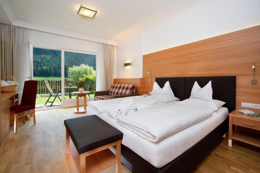 Postel nebo postele na pokoji v ubytování Hotel Grones