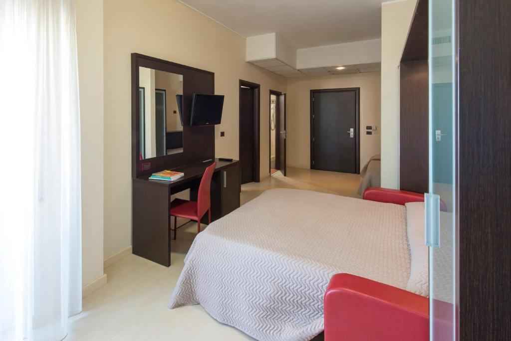 Postel nebo postele na pokoji v ubytování Grand Hotel Adriatico