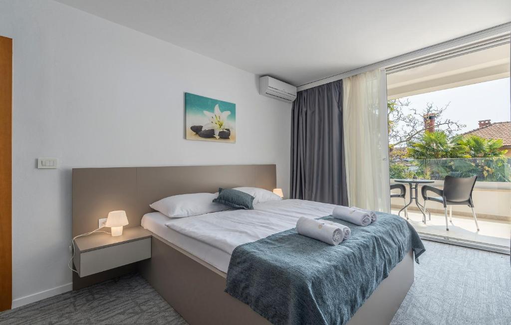 Postel nebo postele na pokoji v ubytování Villa Ladavac B&B