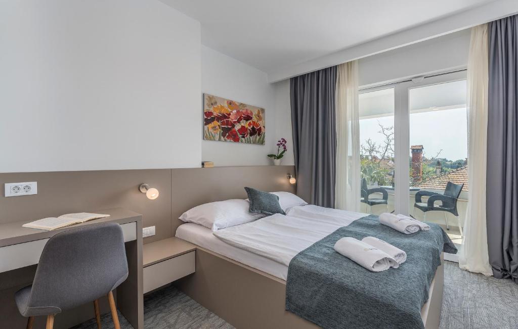 Postel nebo postele na pokoji v ubytování Villa Ladavac B&B