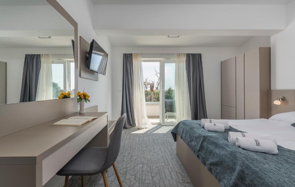 Postel nebo postele na pokoji v ubytování Villa Ladavac B&B