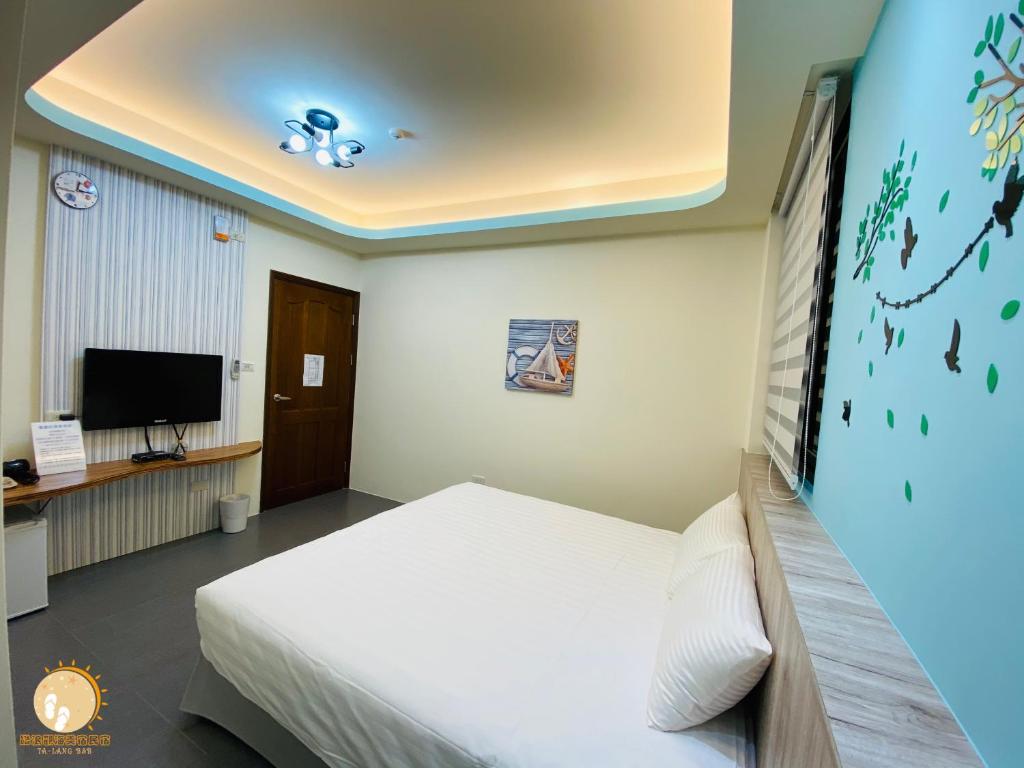 TV a/nebo společenská místnost v ubytování Ta Lang Guan Hai Mei Su B&B