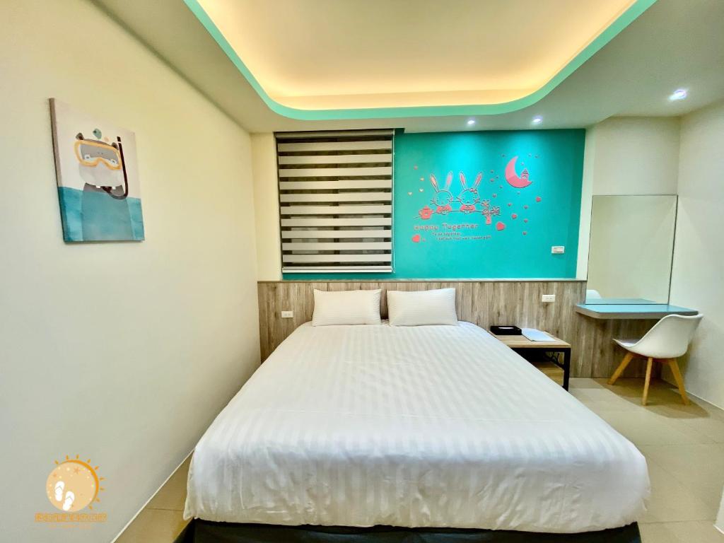 Postel nebo postele na pokoji v ubytování Ta Lang Guan Hai Mei Su B&B