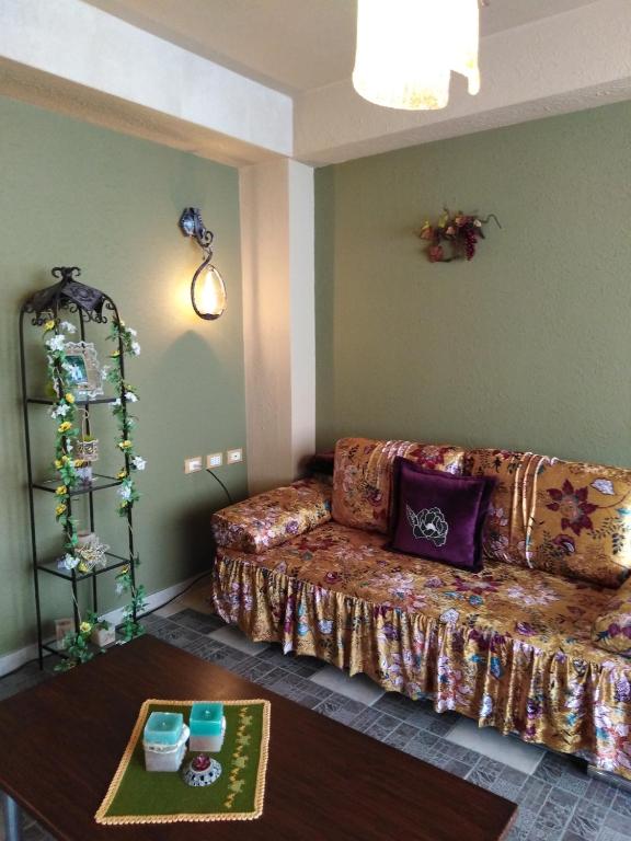 a living room with a couch and a table at DOWN TOWN LUXURY Apartment in Sarandë