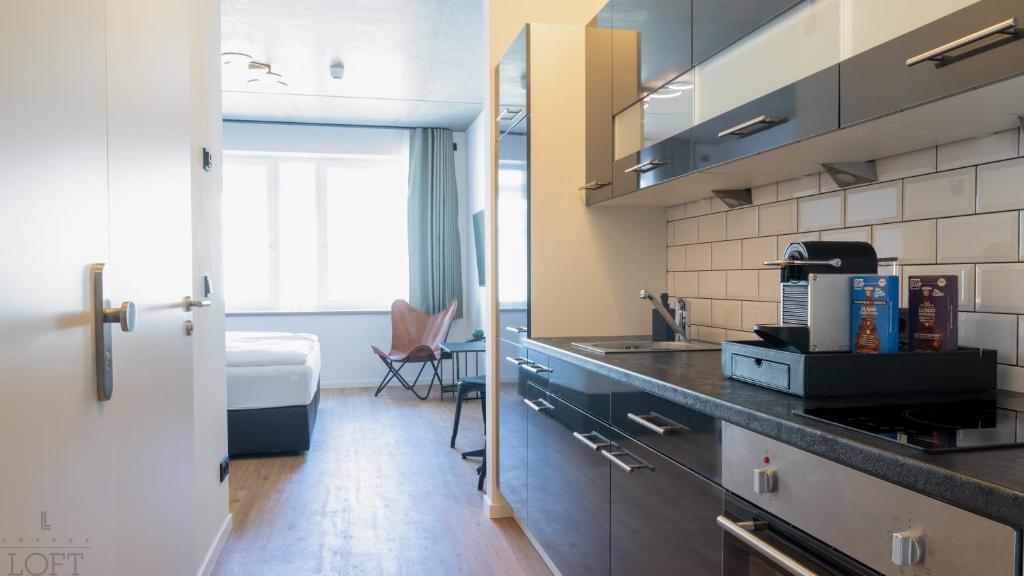 Kuchyň nebo kuchyňský kout v ubytování LÜTTES LOFT Boutique Hotel