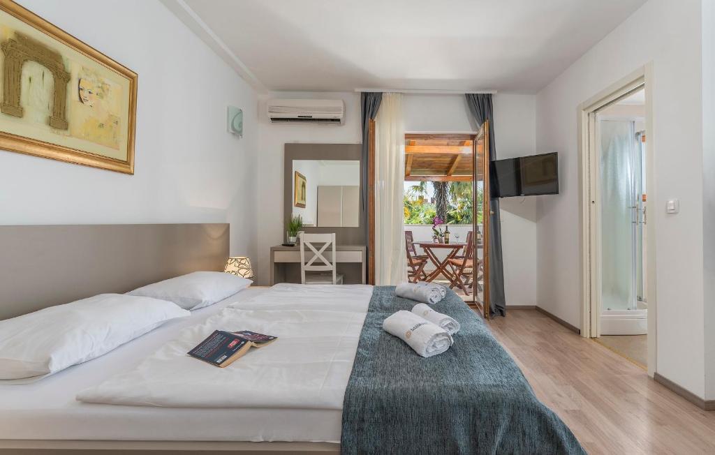 Postel nebo postele na pokoji v ubytování Villa Ladavac B&B