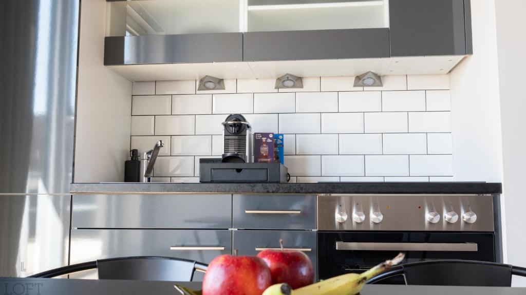 Kuchyň nebo kuchyňský kout v ubytování LÜTTES LOFT Boutique Hotel