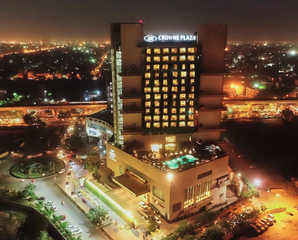 a view of a hotel at night at Crowne Plaza New Delhi Rohini, an IHG Hotel in New Delhi