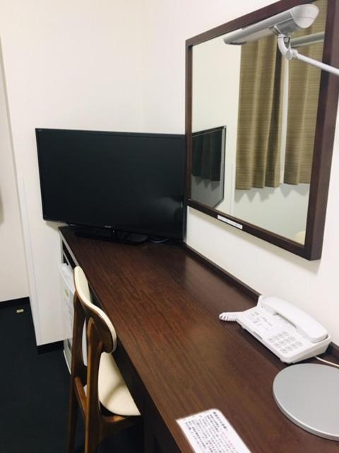 TV a/nebo společenská místnost v ubytování Fuchu Urban Hotel Annex