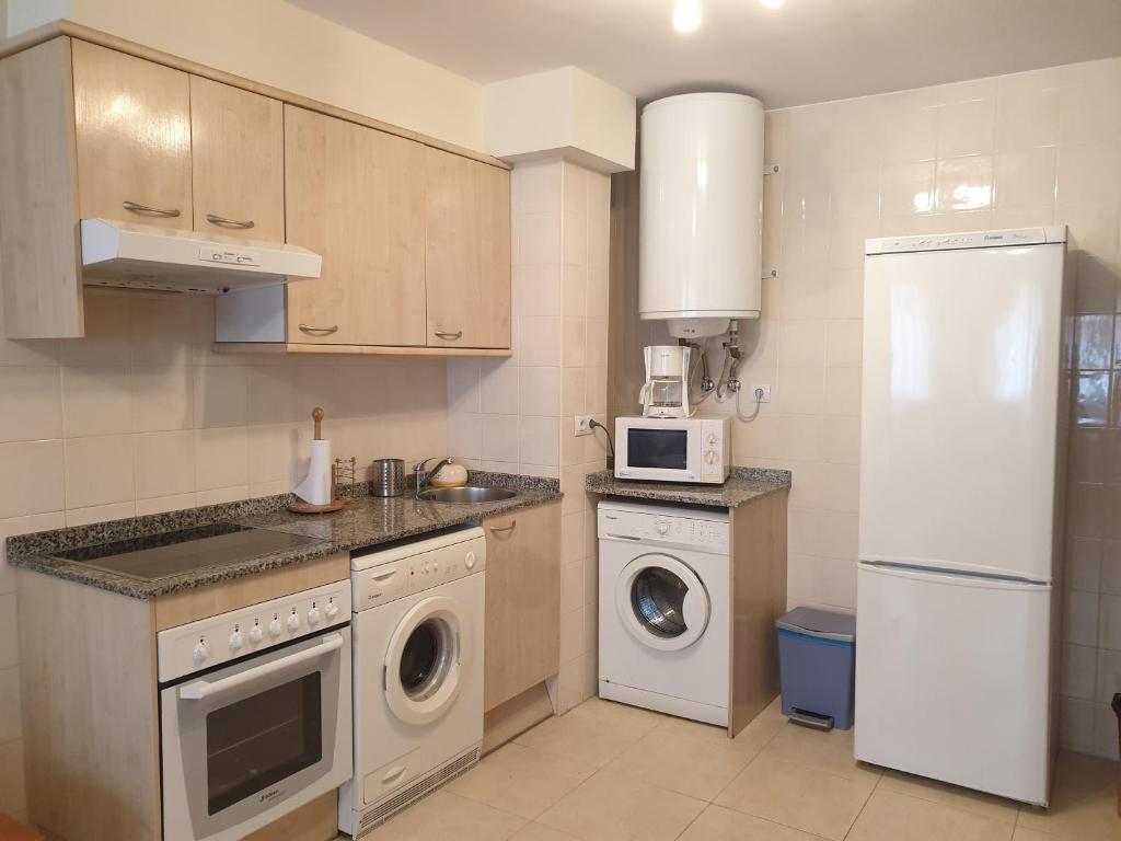 Kuchyň nebo kuchyňský kout v ubytování Apartamento Las Pontigas