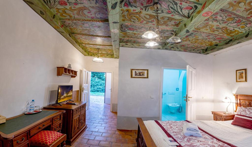 Postel nebo postele na pokoji v ubytování Loreta Hotel