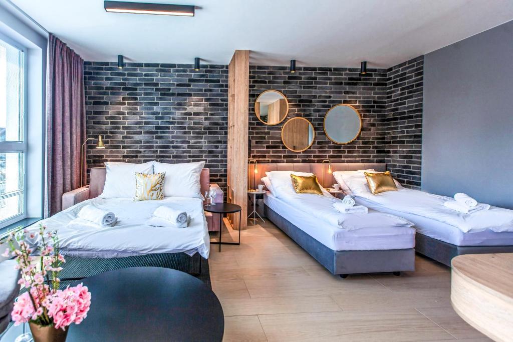 Posteľ alebo postele v izbe v ubytovaní Megi & Greg Apartments
