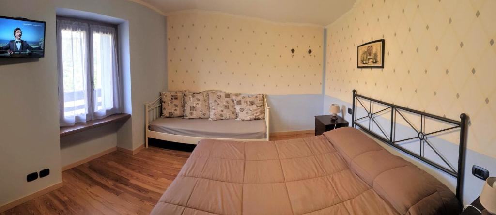 Postel nebo postele na pokoji v ubytování B&B Casa Arcangeli