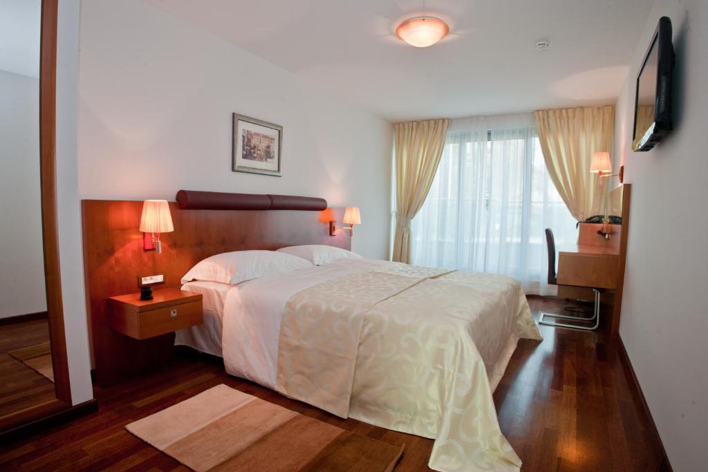 Postel nebo postele na pokoji v ubytování Hotel Croatia
