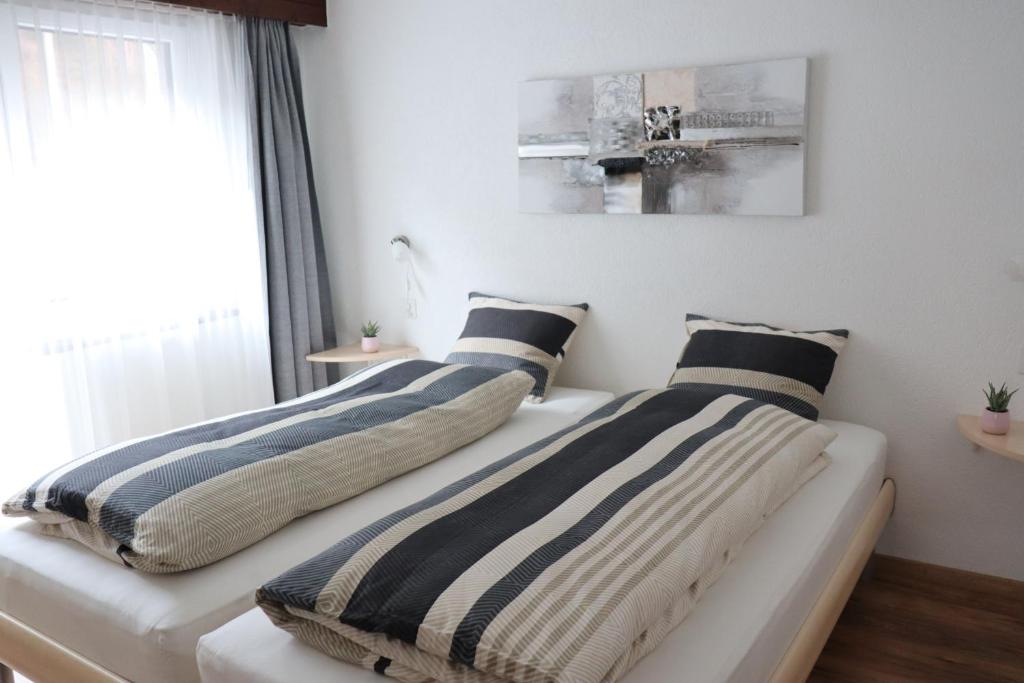 Postel nebo postele na pokoji v ubytování Ferienhaus Alea