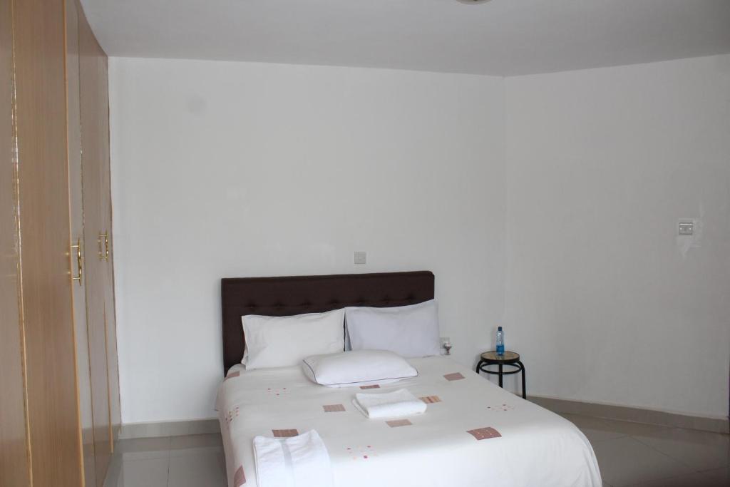 Postel nebo postele na pokoji v ubytování Salient Guest House