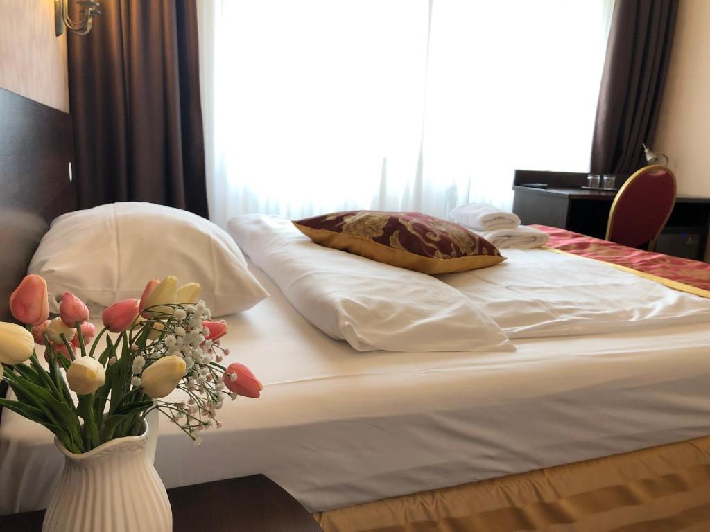 Postel nebo postele na pokoji v ubytování Atlas Berlin Hotel