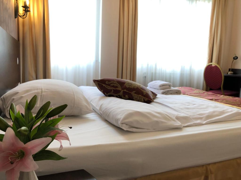 Postel nebo postele na pokoji v ubytování Atlas Berlin Hotel