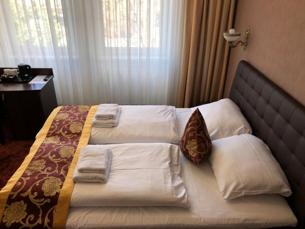 Postel nebo postele na pokoji v ubytování Atlas Berlin Hotel