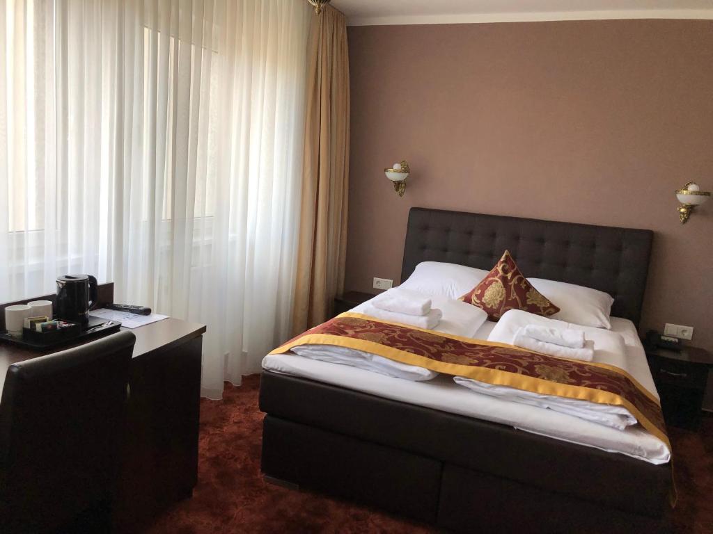 Postel nebo postele na pokoji v ubytování Atlas Berlin Hotel
