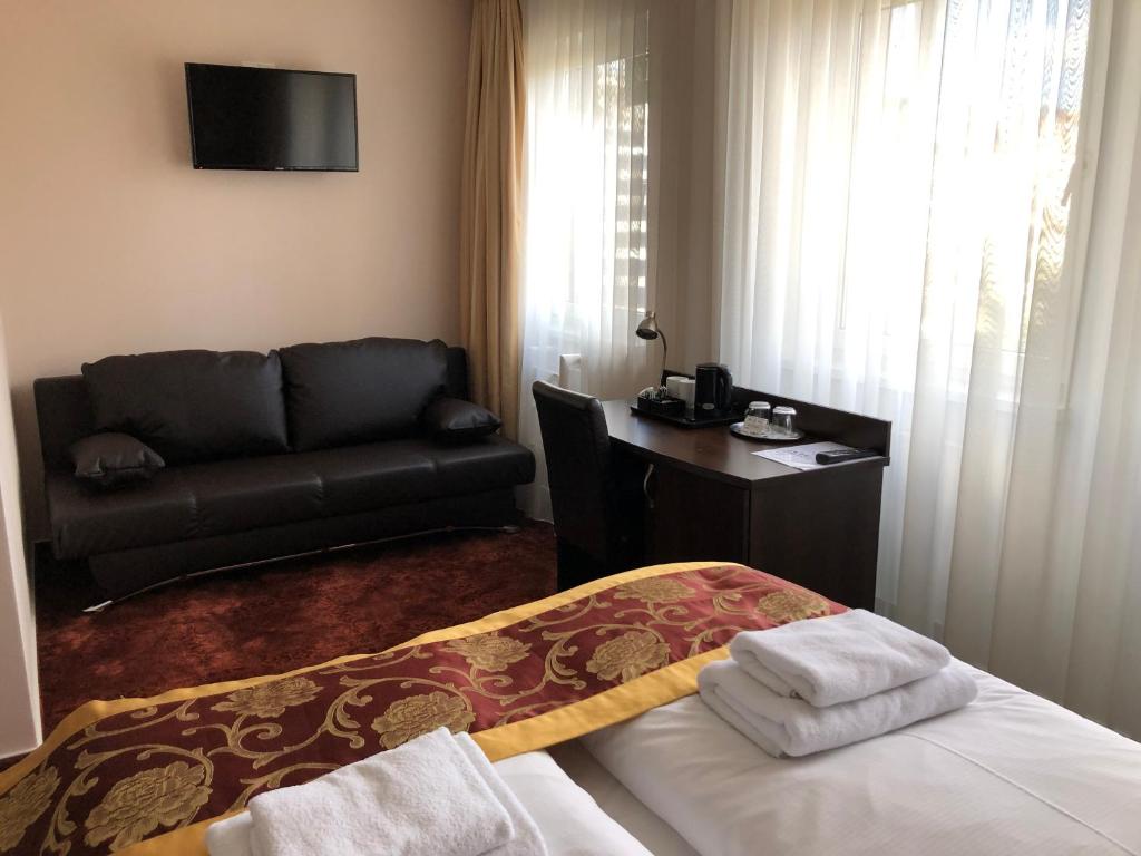 Postel nebo postele na pokoji v ubytování Atlas Berlin Hotel