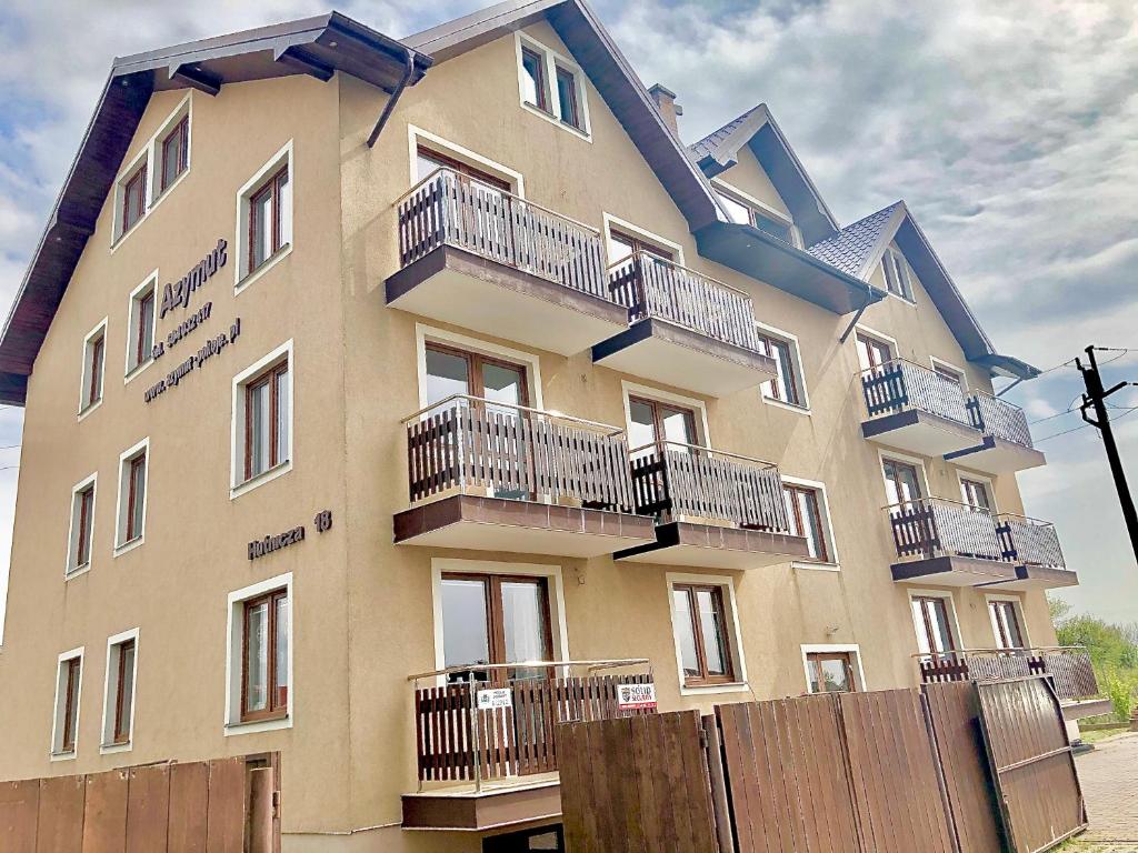 a building with balconies on the side of it at Azymut in Władysławowo