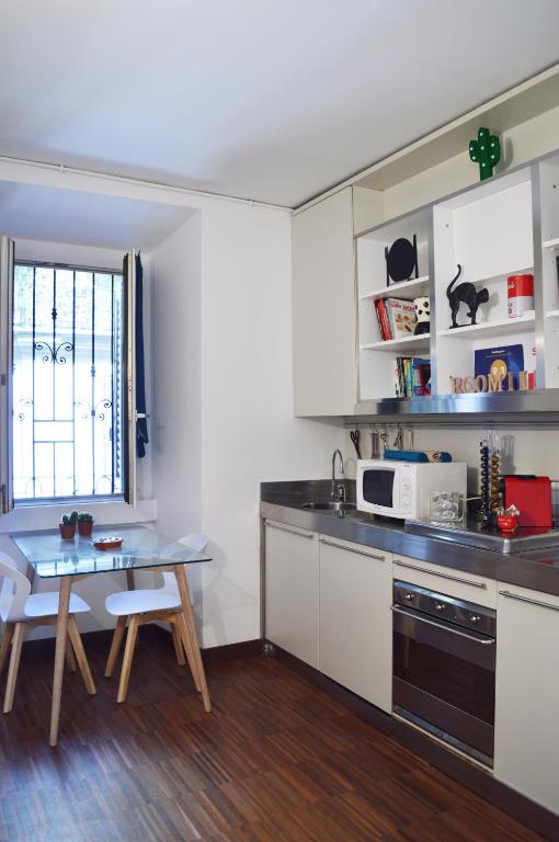 Kuchyň nebo kuchyňský kout v ubytování Room Inn