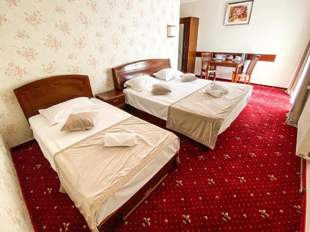 Postel nebo postele na pokoji v ubytování Pensiunea de Vis