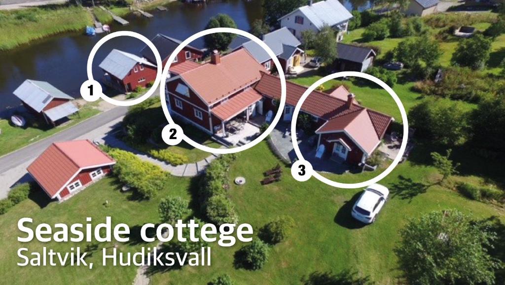 una vista aerea di una casa con le parole "Cottage Sakha appartato" di Seaside Cottage Nr 3, Saltvik Hudiksvall a Hudiksvall