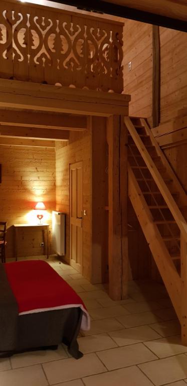 Voodi või voodid majutusasutuse Le Jura en toutes saisons Piscine, SPA, location VTT, balades 2cv, climatisation toas