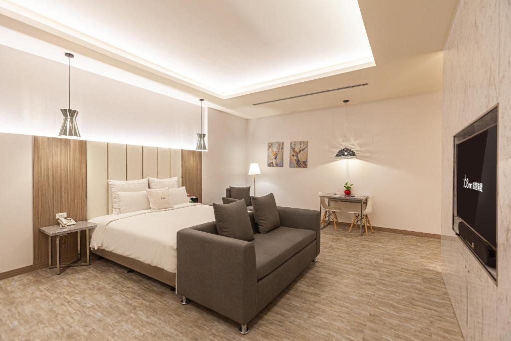 Postel nebo postele na pokoji v ubytování Six Star Motel-Zhongli