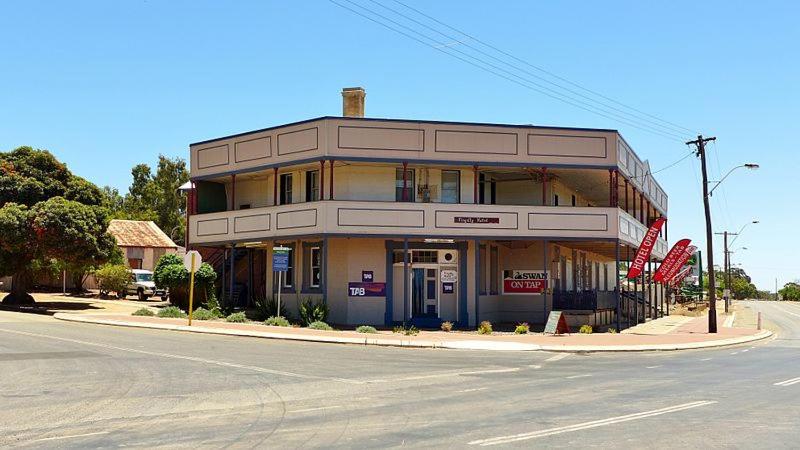 a large building on the corner of a street at Pingelly Hotel in Pingelly