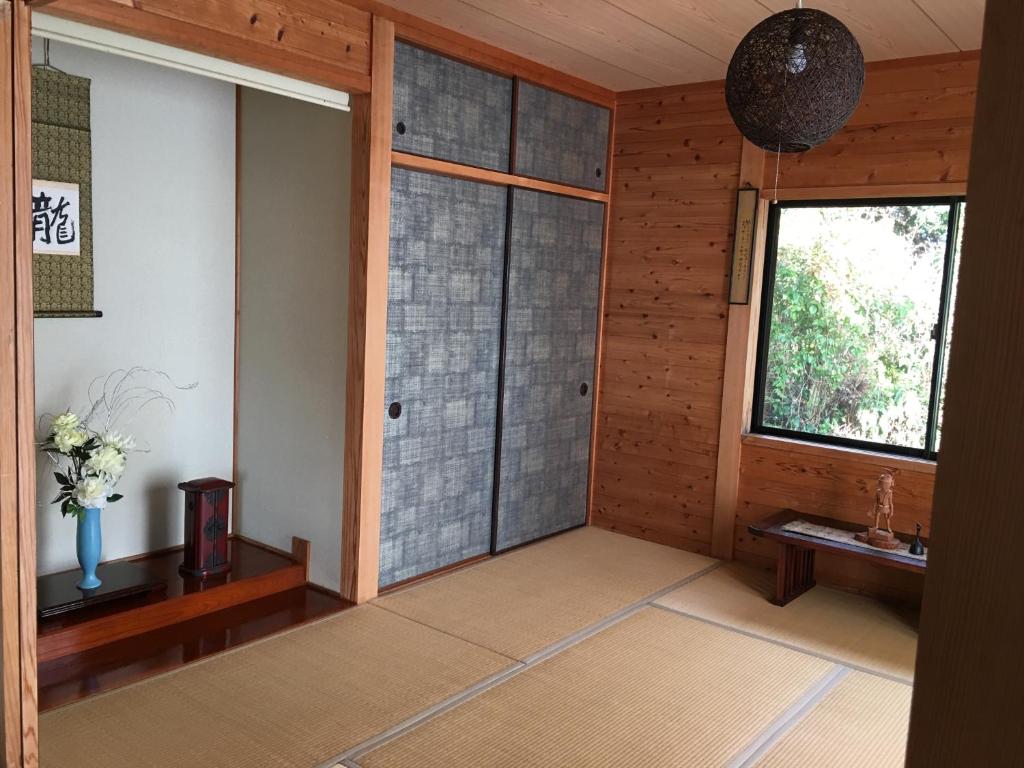 Postel nebo postele na pokoji v ubytování 屋久島シエスタYakushima Entire house with a wonderful view