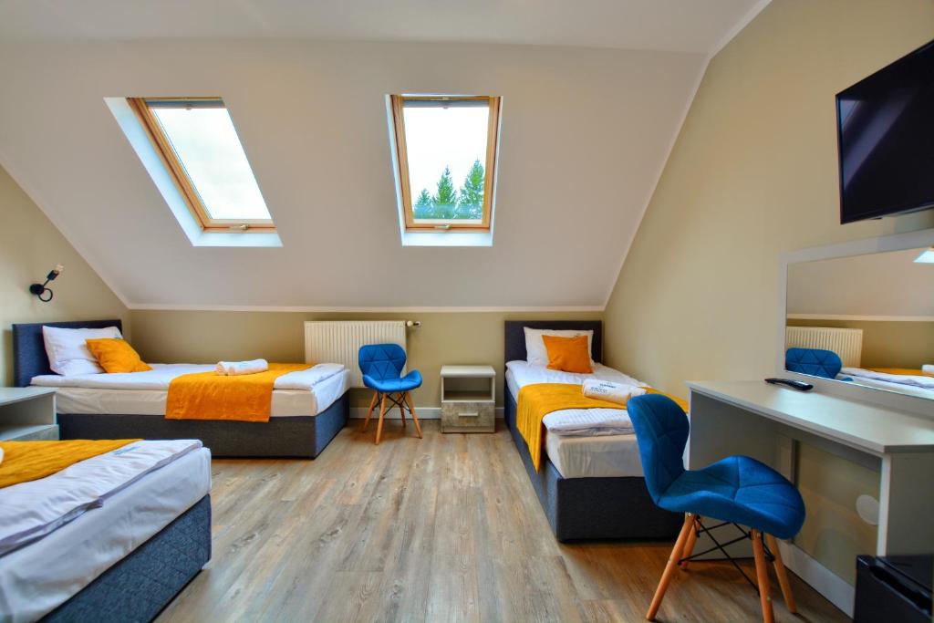 Postel nebo postele na pokoji v ubytování SPA & RESORT BUKOWIEC