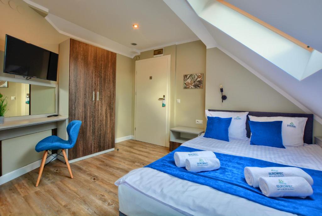 Postel nebo postele na pokoji v ubytování SPA & RESORT BUKOWIEC