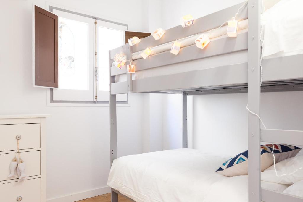 Posteľ alebo postele v izbe v ubytovaní L'Havanera Boutique Home
